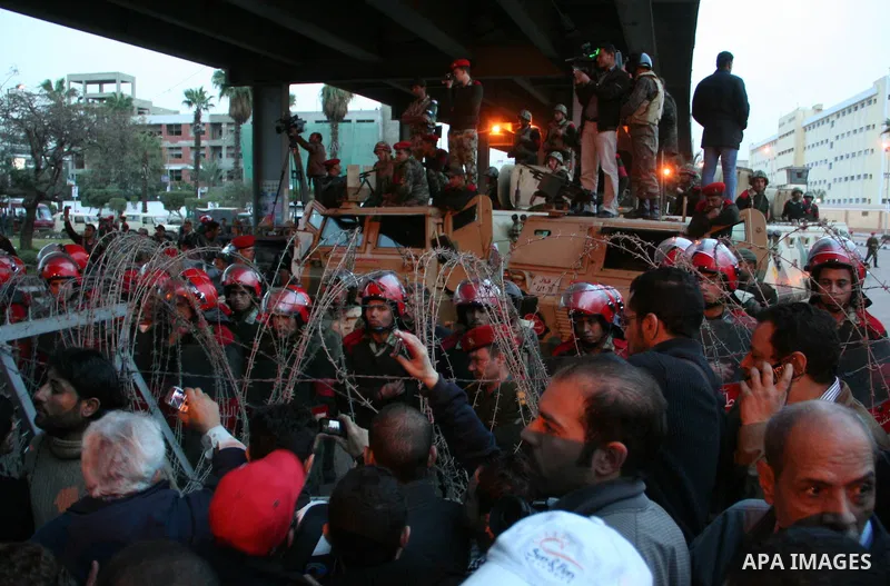 Demonstrators take part in a protest demanding that the army to hand power over to civilians, near the defence ministry in Cairo February 10, 2012. Egypt's religious authorities called on unions and youth groups to scrap...