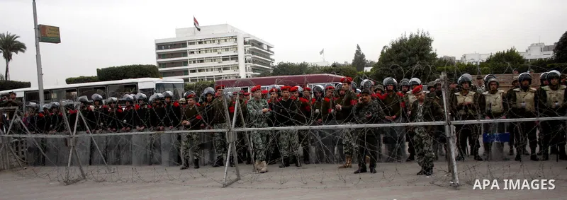 Egyptian soldiers stand guard during an anti-military rally near the Defense Ministry in Cairo, Egypt, Friday, Feb. 10, 2012. Photo by Osama Hamamm