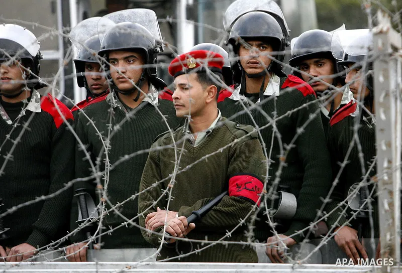 Egyptian soldiers stand guard during an anti-military rally near the Defense Ministry in Cairo, Egypt, Friday, Feb. 10, 2012. Photo by Osama Hamamm