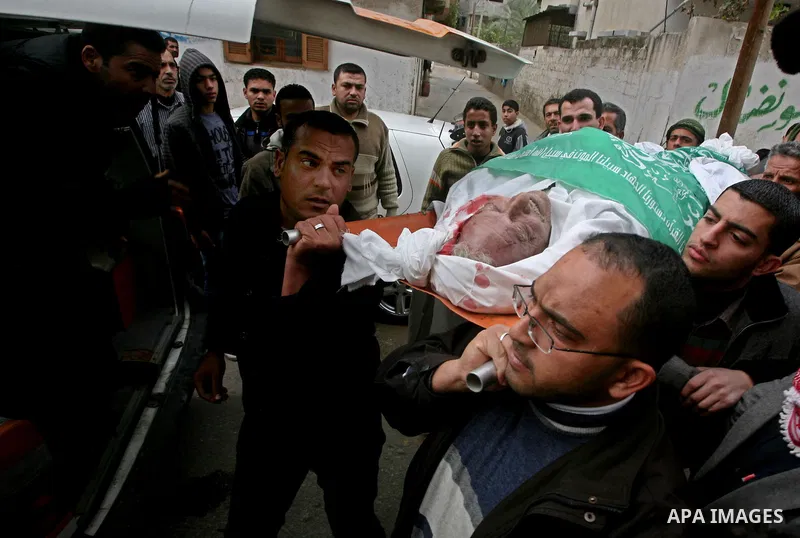 Palestinians carry the body of Abed Kareem Zaytoneya during his funeral in Gaza City February 12, 2012. An Israeli air strike on the Gaza Strip killed a Palestinian civilian, Zaytoneya, on Sunday, hospital officials said...