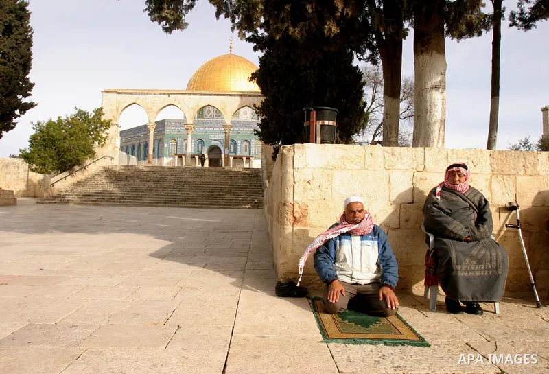 Palestinians protestors gather in front of Al-Aqsa mosque in the old city of Jerusalem, on February 12, 2012, as Israeli Police barred non-Muslims from visiting the Al-Aqsa mosque complex after right-wing Jewish activist...