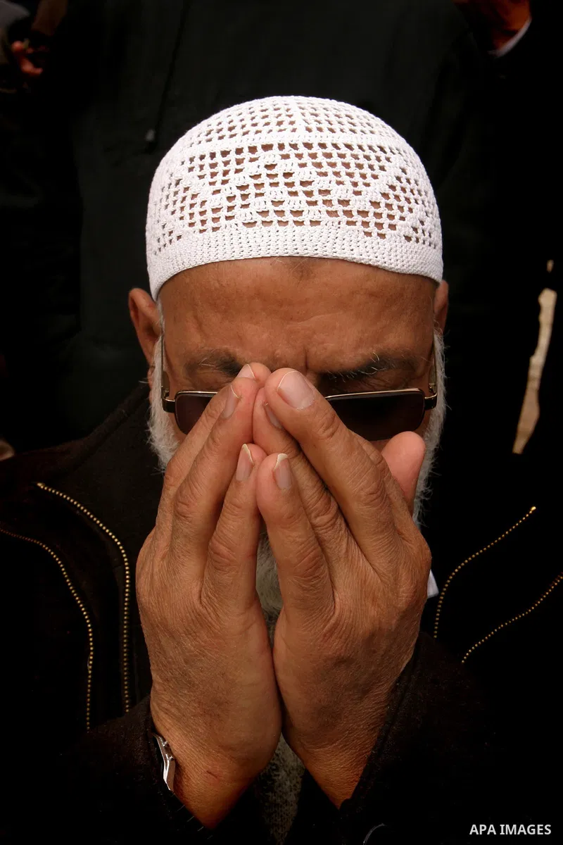 Palestinians protestors gather in front of Al-Aqsa mosque in the old city of Jerusalem, on February 12, 2012, as Israeli Police barred non-Muslims from visiting the Al-Aqsa mosque complex after right-wing Jewish activist...