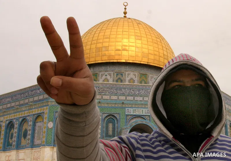 Palestinians protestors gather in front of Al-Aqsa mosque in the old city of Jerusalem, on February 12, 2012, as Israeli Police barred non-Muslims from visiting the Al-Aqsa mosque complex after right-wing Jewish activist...
