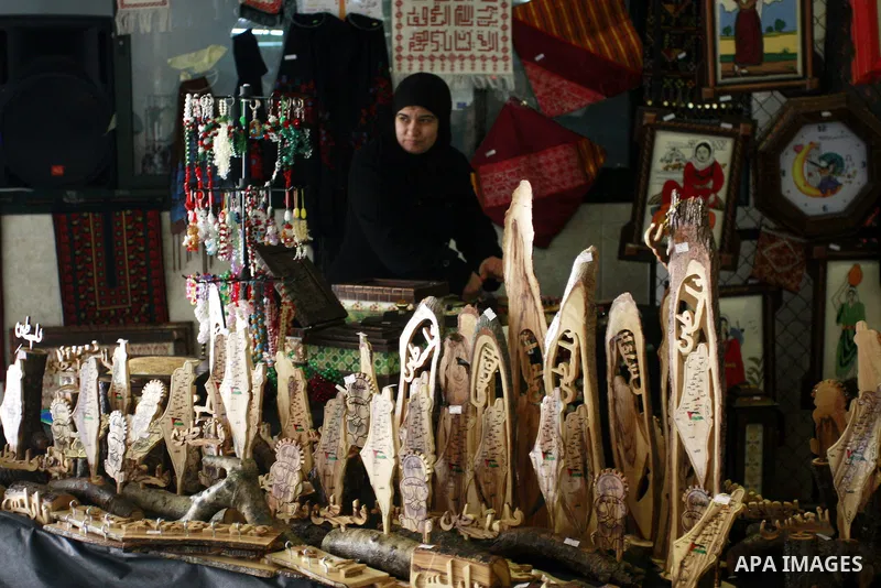 Palestinians participate in an exhibition for the Palestinian heritage in the West Bank city of Nablus, Sunday, Feb. 12, 2012 . Photo by Wagdi Eshtayah