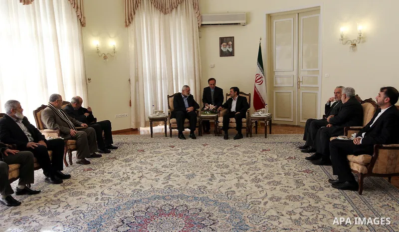 Iranian president Mahmoud Ahmadinejad welcomes the prime minister of the Gaza strip and leading member of the Hamas movement, Ismail Haniyeh at the presidential office in Tehran, Iran, 12 February 2012. Haniyeh arrived o...