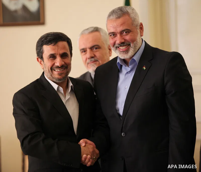 Iranian president Mahmoud Ahmadinejad welcomes the prime minister of the Gaza strip and leading member of the Hamas movement, Ismail Haniyeh at the presidential office in Tehran, Iran, 12 February 2012. Haniyeh arrived o...