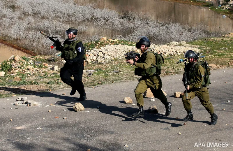 Israeli security officers fire tear gas canisters during clashes with stone-throwing Palestinian demonstrators at a protest held in solidarity with prisoner Khader Adnan, a member of the Islamic Jihad militant group, out...