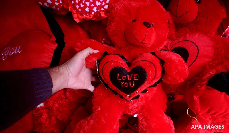 A Palestinian man decorates his shop during the Valentine's Day in Gaza City on Feb. 14, 2012. Valentine's Day is celebrated each year on 14 February. Photo by Ashraf Amra