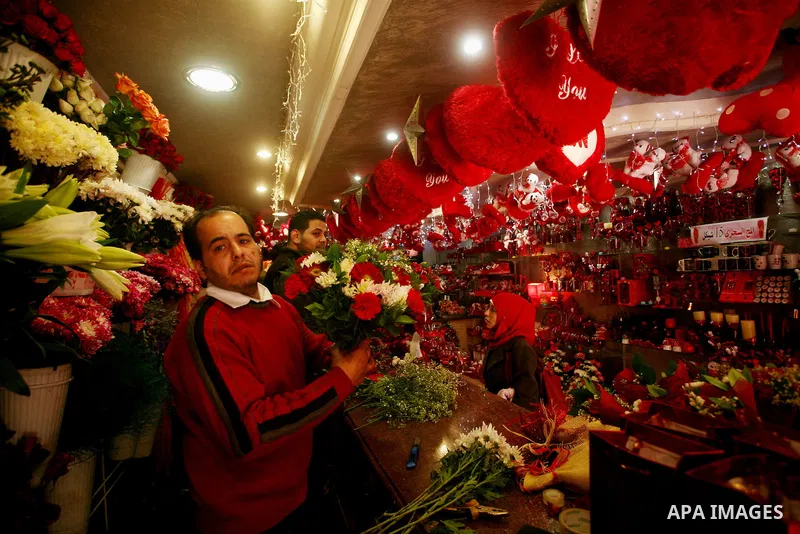 A Palestinian man decorates his shop during the Valentine's Day in Gaza City on Feb. 14, 2012. Valentine's Day is celebrated each year on 14 February. Photo by Ashraf Amra