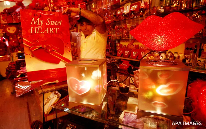 A Palestinian man decorates his shop during the Valentine's Day in Gaza City on Feb. 14, 2012. Valentine's Day is celebrated each year on 14 February. Photo by Ashraf Amra