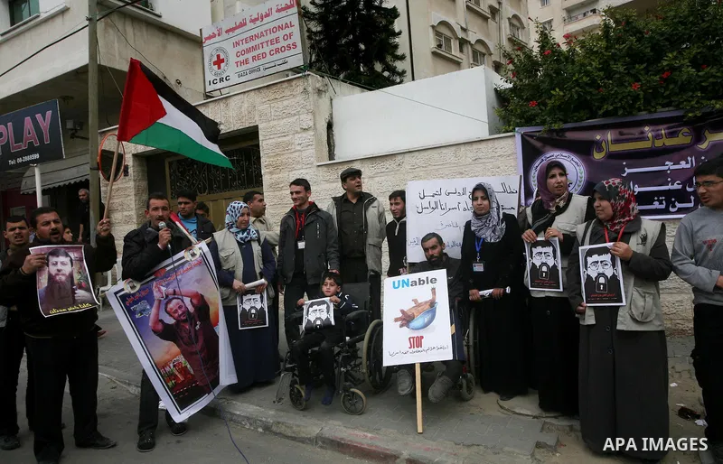 Palestinians,take part in a protest in front of French Center calling for release of Palestinian prisoner Khader Adnan, a member of the Islamic Jihad militant group, in Gaza City, February 14, 2012. Adnan has been on hun...