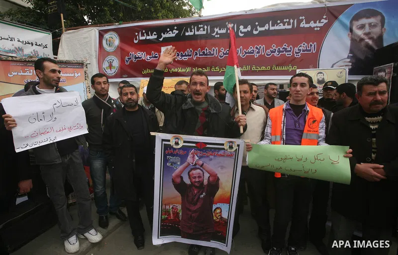 Palestinians,take part in a protest in front of French Center calling for release of Palestinian prisoner Khader Adnan, a member of the Islamic Jihad militant group, in Gaza City, February 14, 2012. Adnan has been on hun...