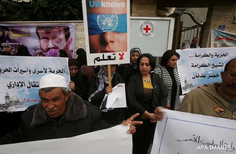 Palestinians,take part in a protest in front of French Center calling for release of Palestinian prisoner Khader Adnan, a member of the Islamic Jihad militant group, in Gaza City, February 14, 2012. Adnan has been on hun...