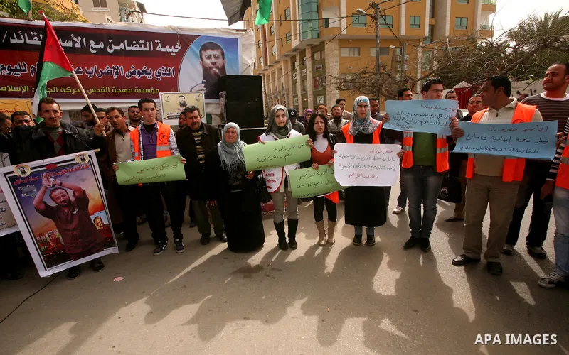 Palestinians,take part in a protest in front of French Center calling for release of Palestinian prisoner Khader Adnan, a member of the Islamic Jihad militant group, in Gaza City, February 14, 2012. Adnan has been on hun...