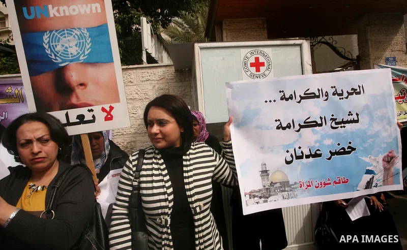 Palestinians,take part in a protest in front of French Center calling for release of Palestinian prisoner Khader Adnan, a member of the Islamic Jihad militant group, in Gaza City, February 14, 2012. Adnan has been on hun...