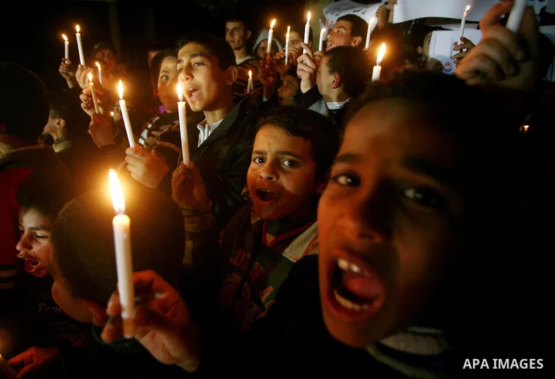 Palestinian schoolchildren hold up candles during a portest in Gaza City calling for supplying the Gaza Strip with enough fuel on February 14, 2012. The impoverished territory's sole power plant, which supplies around a...