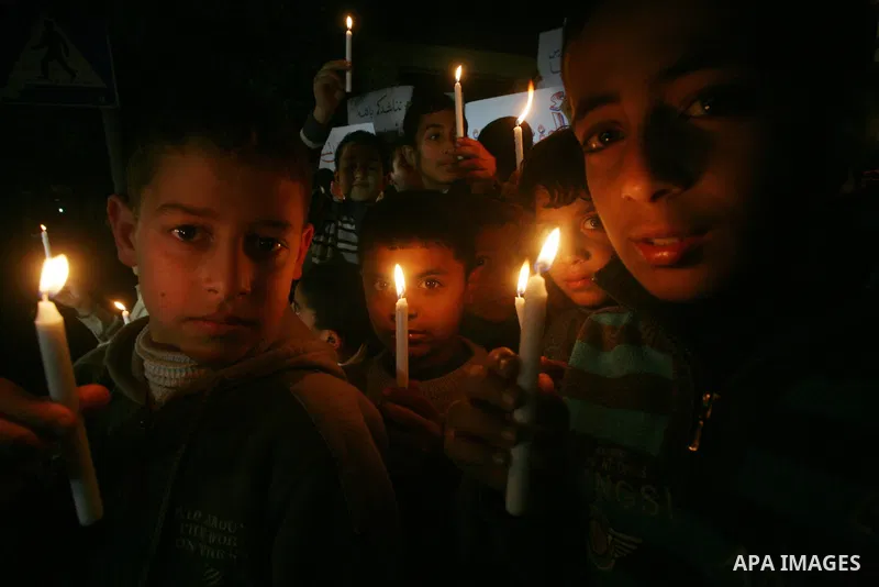 Palestinian schoolchildren hold up candles during a portest in Gaza City calling for supplying the Gaza Strip with enough fuel on February 14, 2012. The impoverished territory's sole power plant, which supplies around a...
