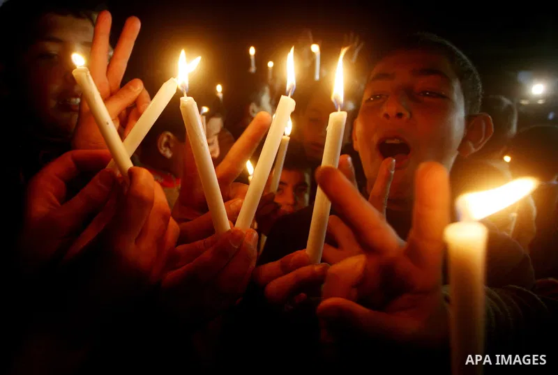 Palestinian schoolchildren hold up candles during a portest in Gaza City calling for supplying the Gaza Strip with enough fuel on February 14, 2012. The impoverished territory's sole power plant, which supplies around a...