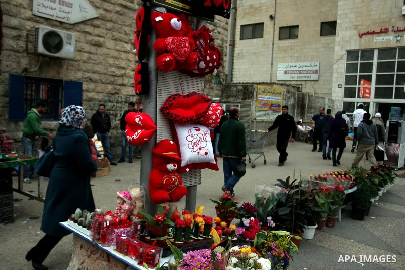 A Palestinian arranges a display of gifts in a shop on Valentine's Day in the West Bank City of Ramallah,14 February 2012. Photo by Issam Rimawi
