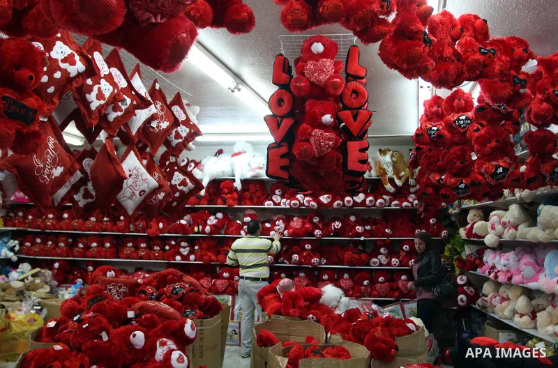 A Palestinian arranges a display of gifts in a shop on Valentine's Day in the West Bank City of Ramallah,14 February 2012. Photo by Issam Rimawi