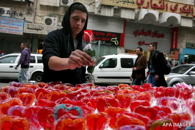 A Palestinian arranges a display of gifts in a shop on Valentine's Day in the West Bank City of Ramallah,14 February 2012. Photo by Issam Rimawi