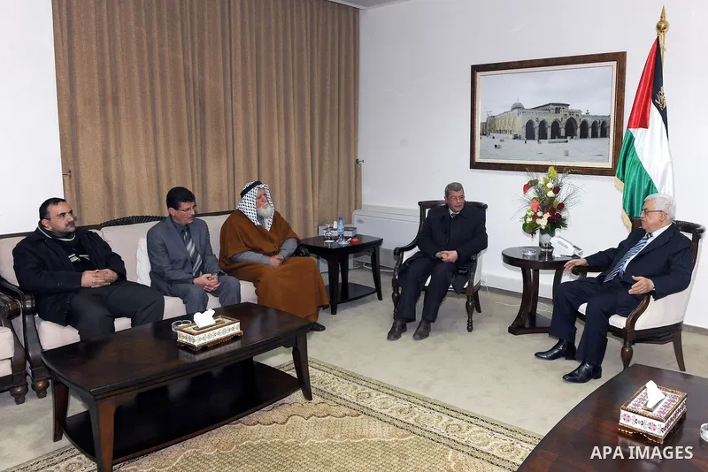 Palestinian President Mahmoud Abbas (Abu Mazen), meets with the family of the prisoner Adnan Khader, in the West Bank City of Ramallah, on Feb. 16, 2012. Photo by Thaer Ganaim