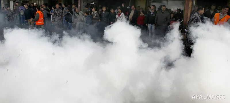 Palestinian firefighters douse a fire during an earthquake drill organised by the civil defence forces in the West Bank city of Jenin on February 16, 2012. Photo by Wagdi Eshtayah