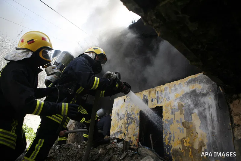 Palestinian firefighters douse a fire during an earthquake drill organised by the civil defence forces in the West Bank city of Jenin on February 16, 2012. Photo by Wagdi Eshtayah
