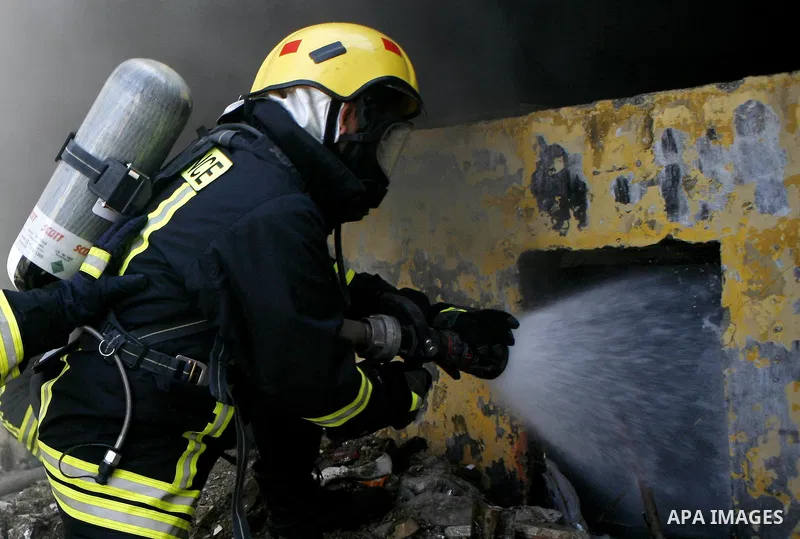 Palestinian firefighters douse a fire during an earthquake drill organised by the civil defence forces in the West Bank city of Jenin on February 16, 2012. Photo by Wagdi Eshtayah