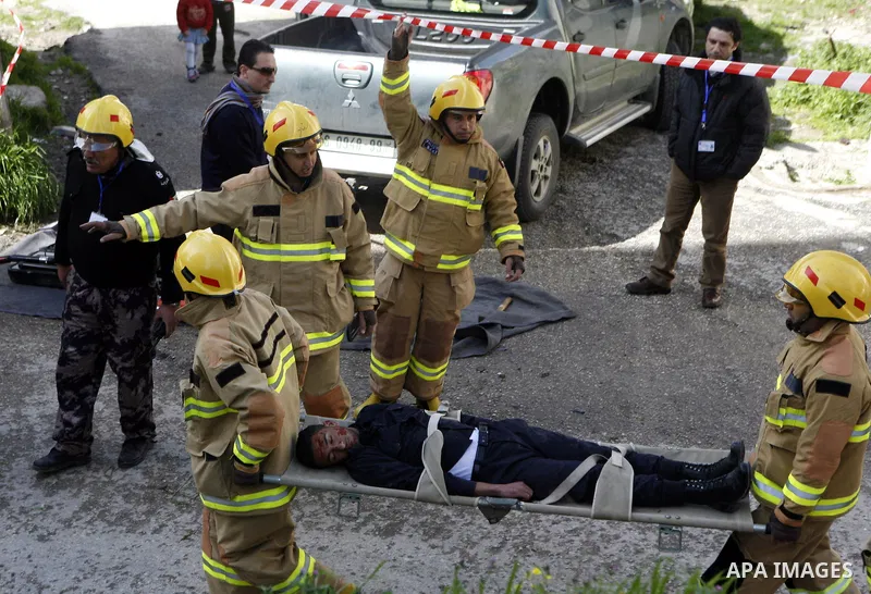 Palestinian firefighters take part in an earthquake drill organised by the civil defence forces in the West Bank city of Jenin on February 16, 2012. Photo by Wagdi Eshtayah