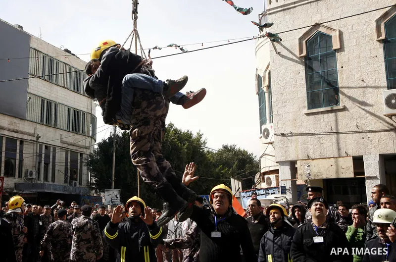 Palestinian firefighters take part in an earthquake drill organised by the civil defence forces in the West Bank city of Jenin on February 16, 2012. Photo by Wagdi Eshtayah