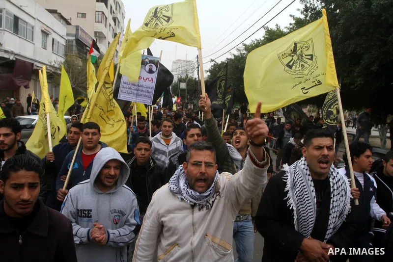 Islamic Jihad activists protest after the Friday noon prayer in support of Khader Adnan, a fellow Palestinian senior militant held in an Israeli prison without trial and who is on hunger strike since December 18, on Febr...