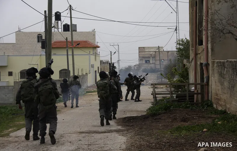 Israeli border police officers fire tear gas towards Palestinian demonstrators, during a protest in the village of Kufr Qaddum against the expansion of the nearby Jewish settlement of Kdumim, in the northern West Bank, F...