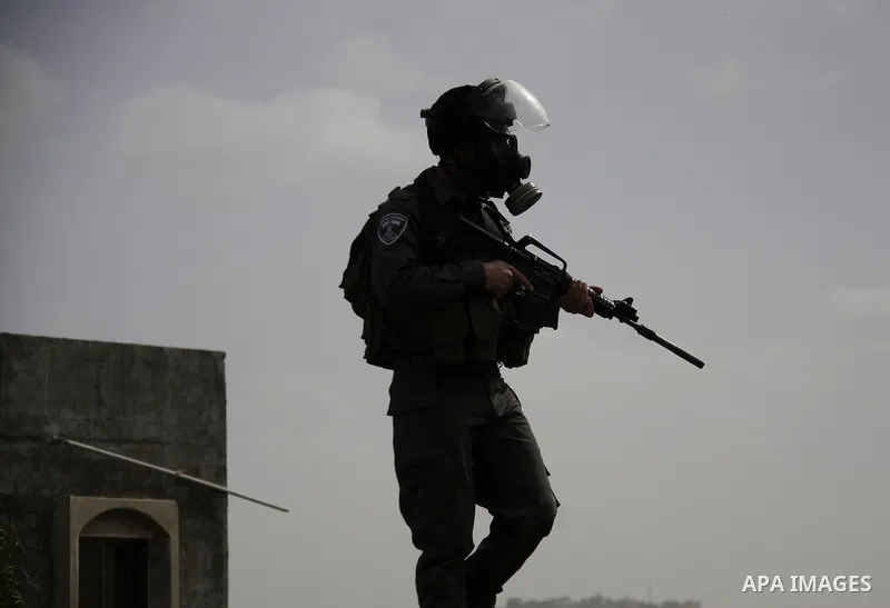 Israeli border police officers fire tear gas towards Palestinian demonstrators, during a protest in the village of Kufr Qaddum against the expansion of the nearby Jewish settlement of Kdumim, in the northern West Bank, F...