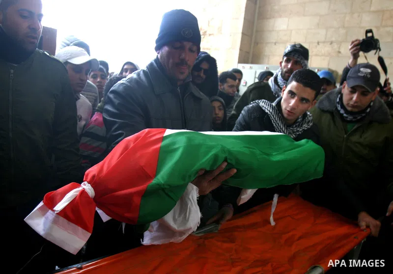 Palestinians take part in the funeral of a child, one of schoolchildren killed in a school bus accident, at Al-Aqsa mosque on Feb.17, 2012. A truck lost control in slick, rainy weather and barreled into a Palestinian sch...