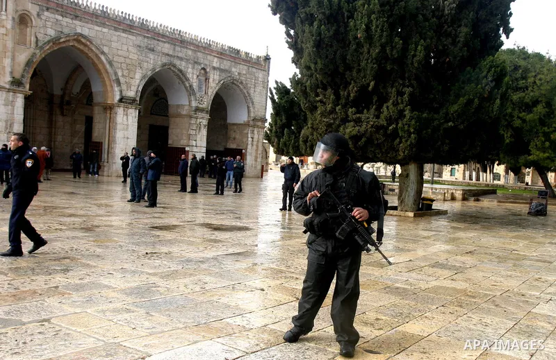 Israeli riot police at the doors to the al-Aqsa Mosque on the Hareem el-Sharif (the Noble Sanctuary), or Temple Mount, in Jerusalem, 19 February 2012, as they battle Palestinians inside during clashes. Israeli police rep...