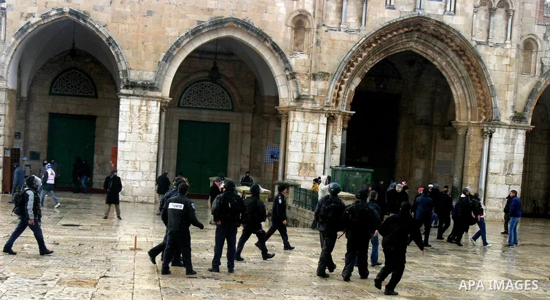Israeli riot police at the doors to the al-Aqsa Mosque on the Hareem el-Sharif (the Noble Sanctuary), or Temple Mount, in Jerusalem, 19 February 2012, as they battle Palestinians inside during clashes. Israeli police rep...