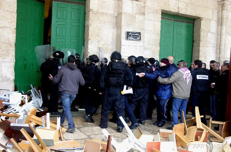 Israeli riot police at the doors to the al-Aqsa Mosque on the Hareem el-Sharif (the Noble Sanctuary), or Temple Mount, in Jerusalem, 19 February 2012, as they battle Palestinians inside during clashes. Israeli police rep...