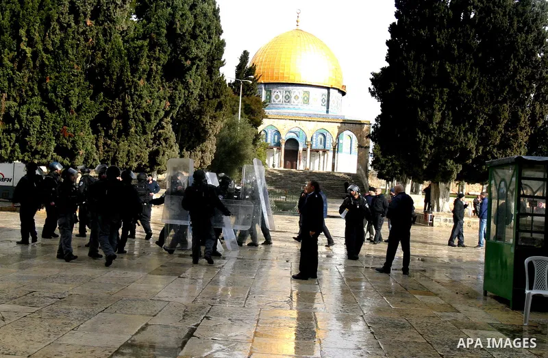 Israeli riot police at the doors to the al-Aqsa Mosque on the Hareem el-Sharif (the Noble Sanctuary), or Temple Mount, in Jerusalem, 19 February 2012, as they battle Palestinians inside during clashes. Israeli police rep...