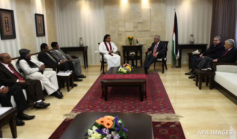 Palestinian Prime Minister, Salam Fayyad meets with presidential envoy on Sri Lanka, Namal Rajpxh, in the West Bank city of Ramallah on Feb, 19, 2012. photo by Mustafa Abu Dayeh.