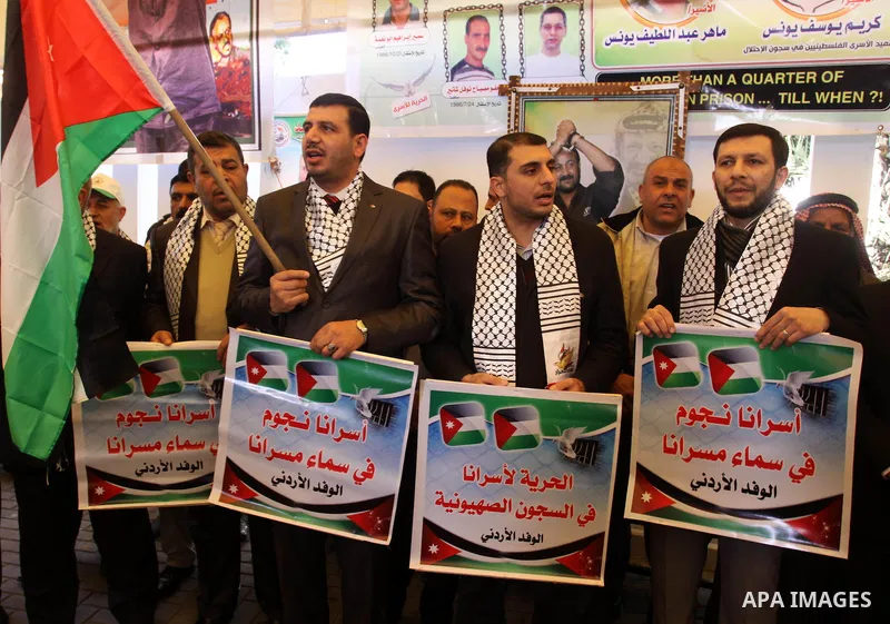 Jordanian delegation take part a protest in front of the Red Cross in Gaza City, calling for the release of Palestinian prisoners from Israeli jails February 20, 2012. Adnan has been on hunger strike for 65 days to prote...