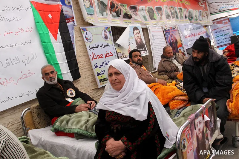 Palestinians on a hunger strike in solidarity with Palestinian prisoner Khader Adnan, a member of the Islamic Jihad militant group, during a protest in front of the Red Cross in Gaza City, calling for the release of Pale...