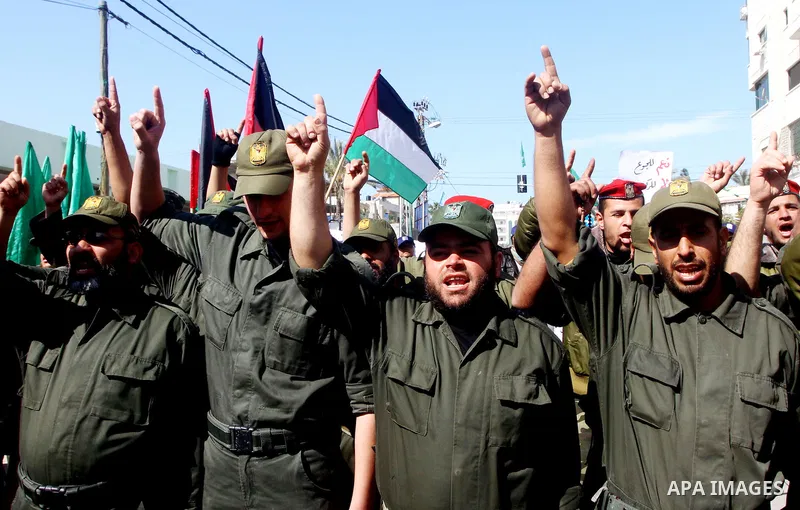 Palestinian policemen take part in a demonstration calling for the release of Palestinian prisoners held in Israeli prisons in front of the Red Cross headquarters in Gaza City, on Feb. 02, 2012. Photo by Ashraf Amra