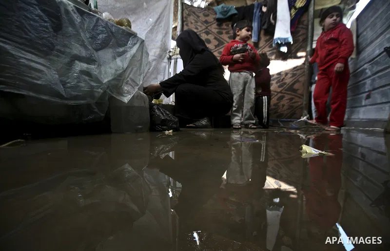 A Palestinian woman cooks inside her family home in the Jabaliya Refugee camp, Gaza Strip, 19 February 2012. The United Nations Relief and Works Agency (UNRWA) states that the Israeli blockade on Gaza has made life more...