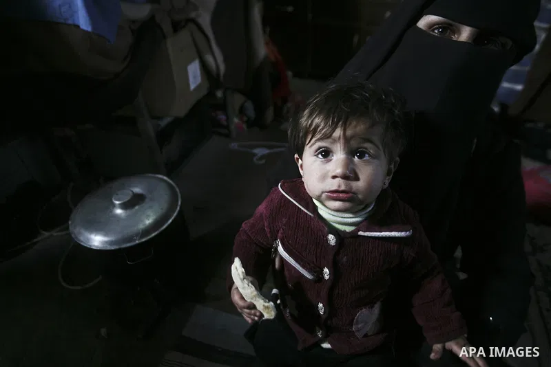 A Palestinian woman cooks inside her family home in the Jabaliya Refugee camp, Gaza Strip, 19 February 2012. The United Nations Relief and Works Agency (UNRWA) states that the Israeli blockade on Gaza has made life more...