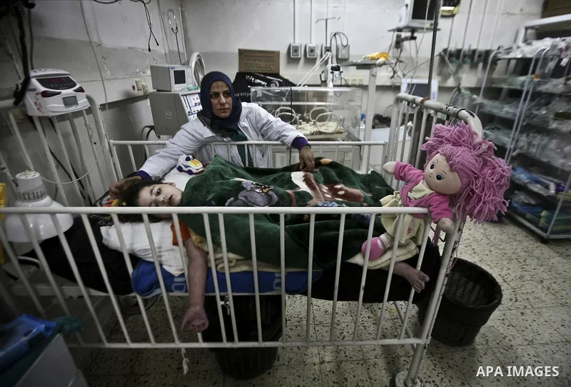 A nurse attends to a Palestinian infant in an incubator at Al-Nasser hospital in Gaza Strip on 20 February 2012. The hospital has been suffering from power cuts after the impoverished territory's sole power plant, that s...