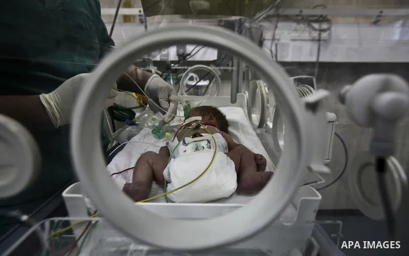 A nurse attends to a Palestinian infant in an incubator at Al-Nasser hospital in Gaza Strip on 20 February 2012. The hospital has been suffering from power cuts after the impoverished territory's sole power plant, that s...