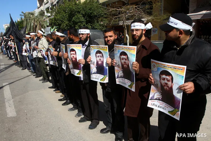 Palestinian supporters of the Islamic Jihad militant group participate in a protest in solidarity with Khader Adnan, a senior member of Islamic Jihad jailed in Israel who has been on hunger strike for 66 days, in Gaza Ci...