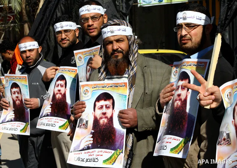 Palestinian supporters of the Islamic Jihad militant group participate in a protest in solidarity with Khader Adnan, a senior member of Islamic Jihad jailed in Israel who has been on hunger strike for 66 days, in Gaza Ci...