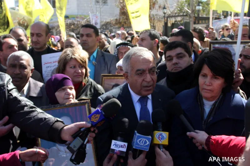 Palestinian Prime Minister Salam Fayyad, attends a protest in support of Islamic Jihad member Khader Adnan outside Ofer prison near the West Bank city of Ramallah February 21, 2012. Adnan, held without trial by Israel, a...